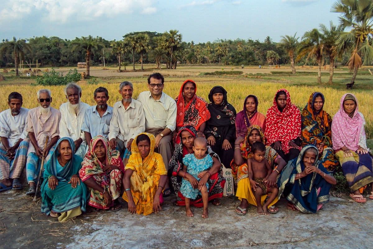 Community members gathered in a village field