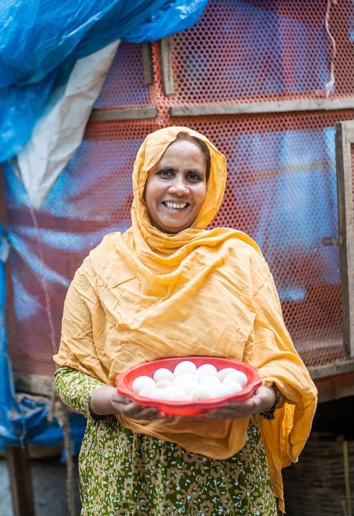 Woman holding a bowl of eggs